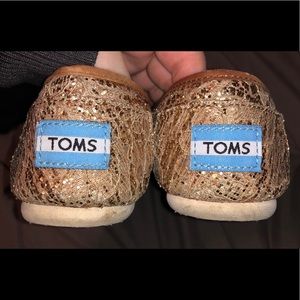 Gold slip on Toms